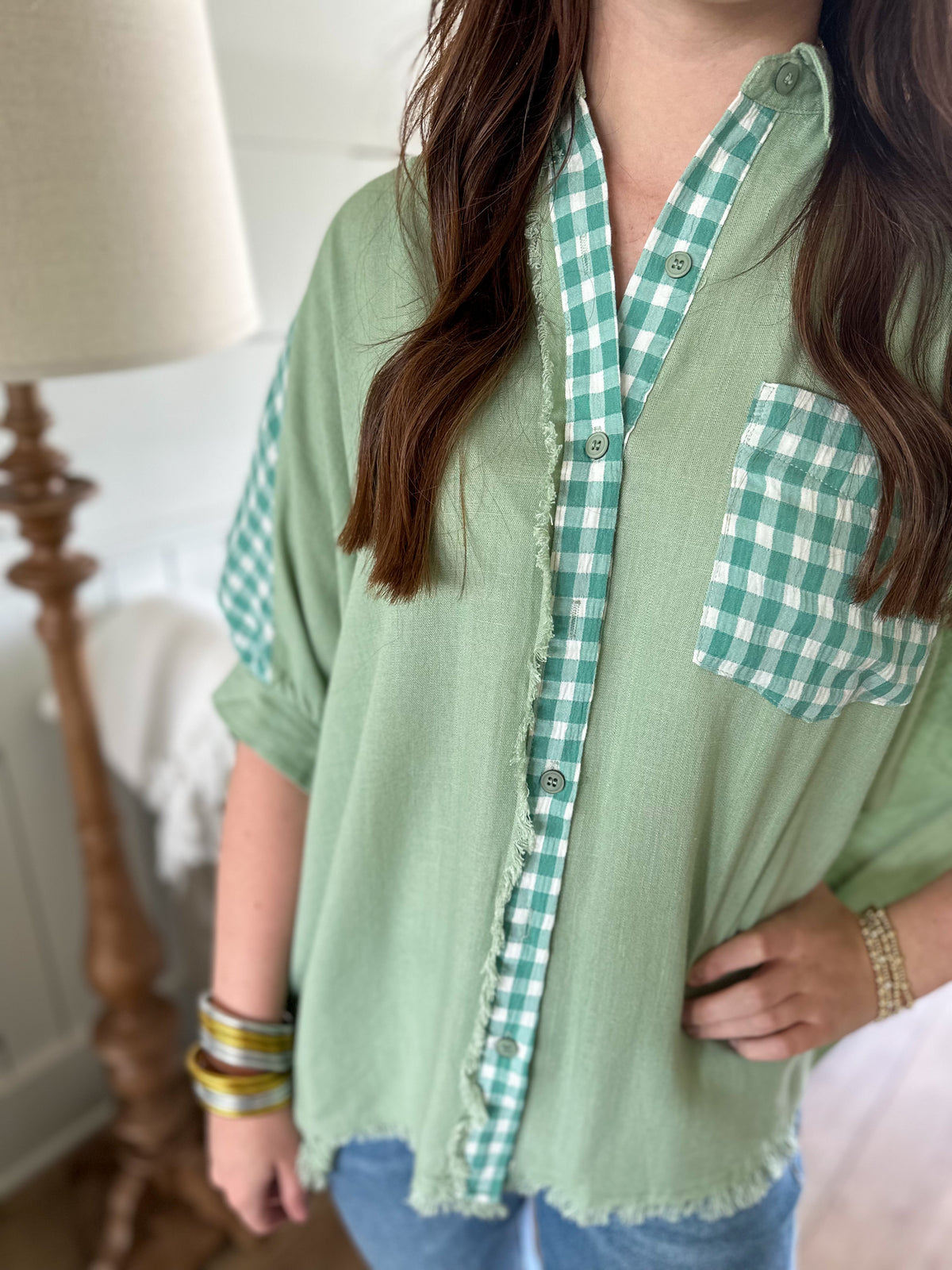 green button down top with checkered accents