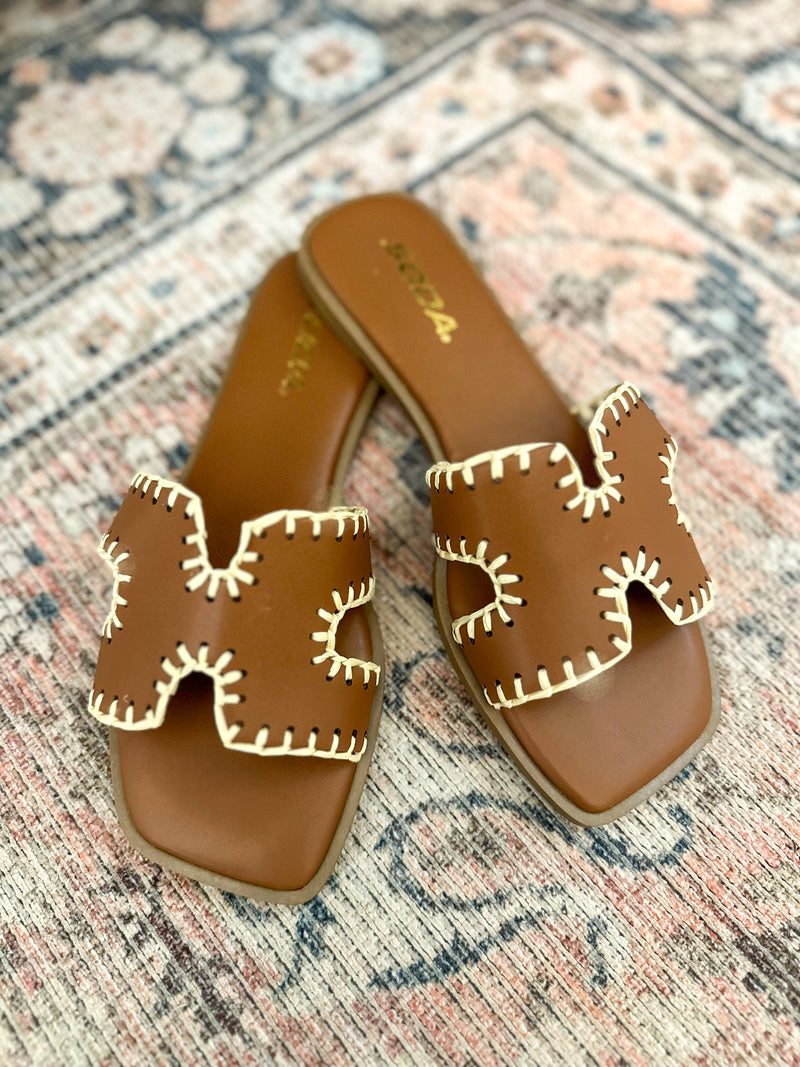 brown sandal with cream accents 