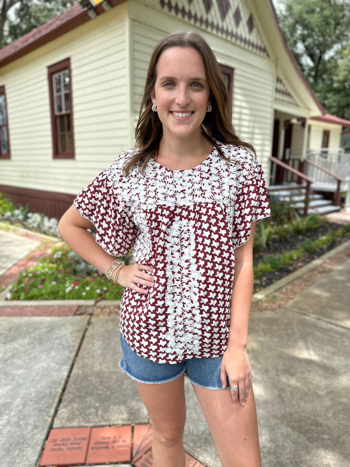 maroon and white texas embroidred top