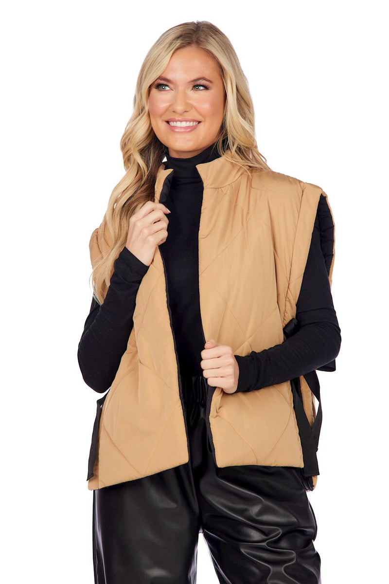 mud pie reversable vest one side tan other side is black 