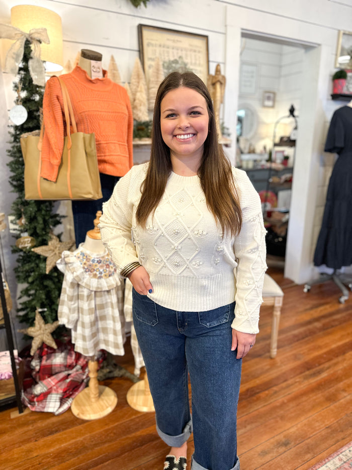 cream color sweater with pearl details 