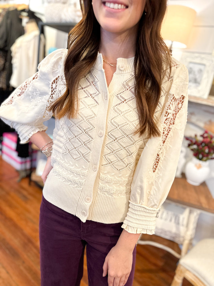 cream color top with crochet details 