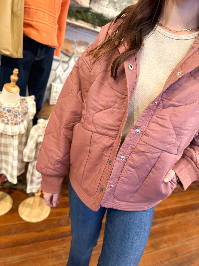 plum color quilted style jacket with button snaps 
