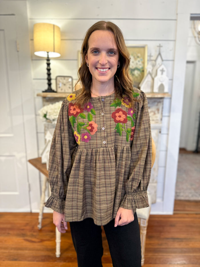 brown and black plaid top brooke top layerz clothing with colorful detail flowers on the front 