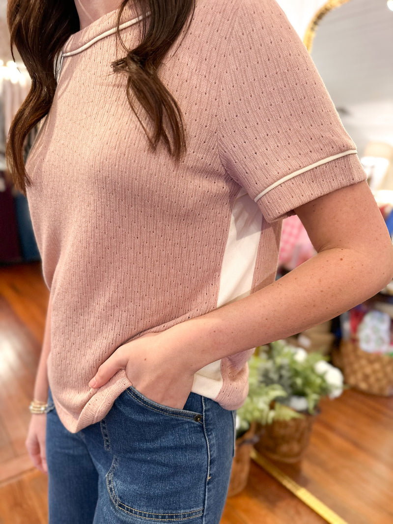 dusty pink relaxed fit top with cream stitching accents