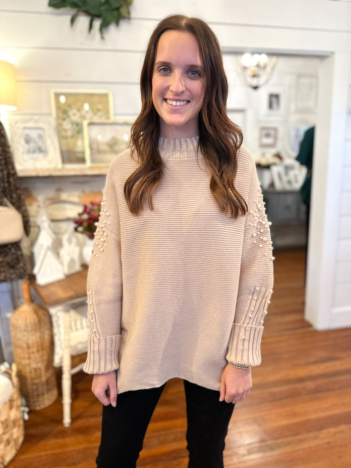 light tan ribbed sweater with pearl details