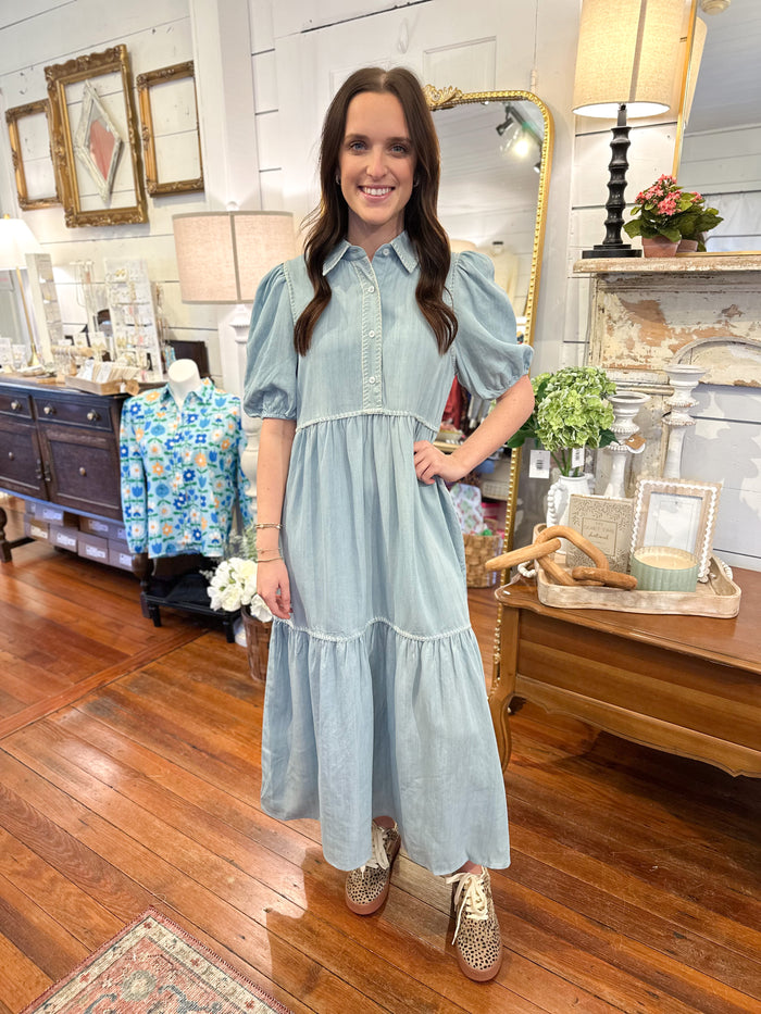 light wash denim blue dress with buttons and cream stitch details 