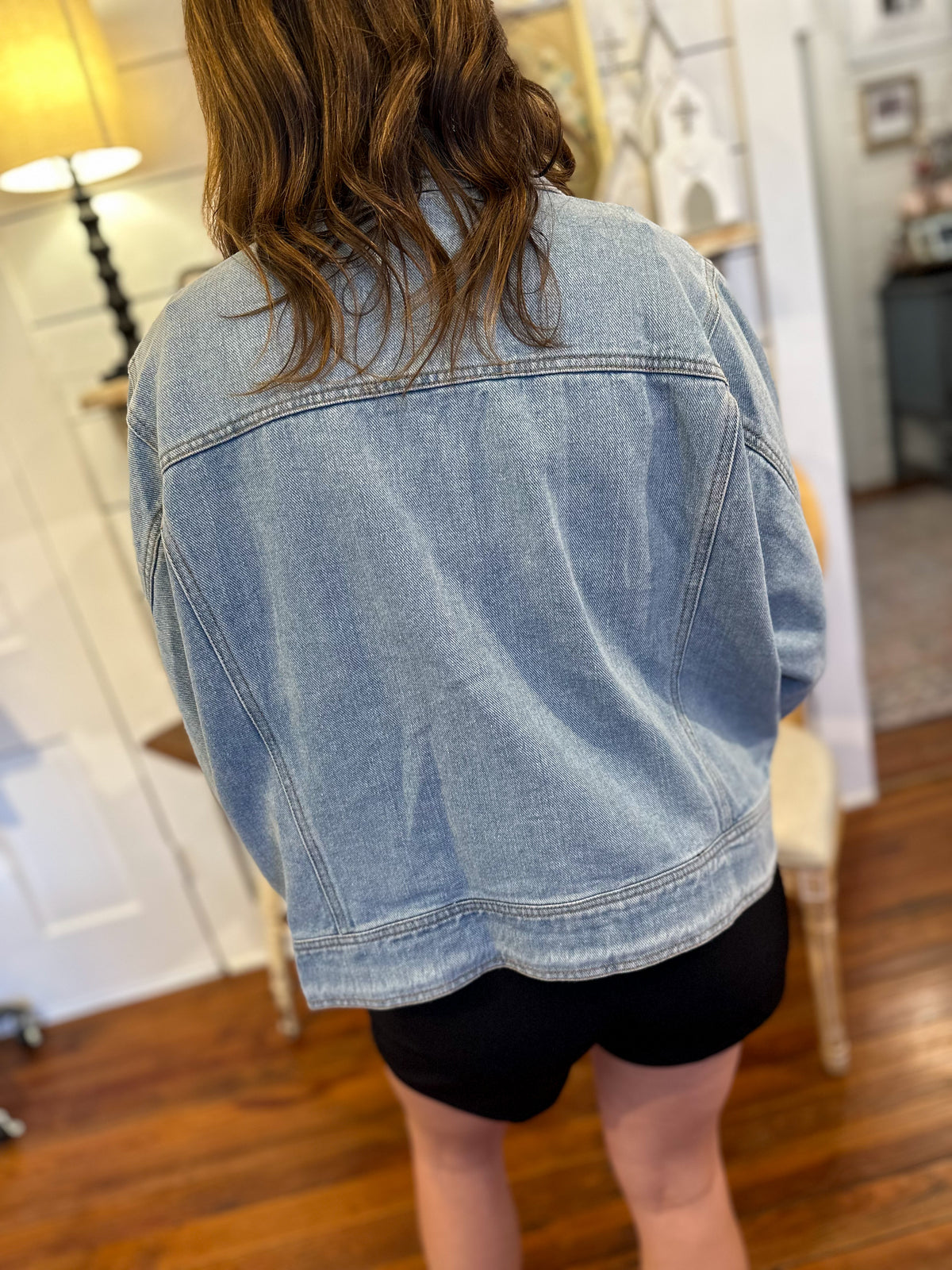 back of light wash entro denim jacket