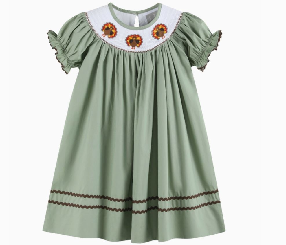 green bishop style dress with turkeys on top neckline